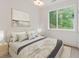 Inviting bedroom with a soft, textured blanket and a serene view at 1171 Lupo Loop, Chattahoochee Hills, GA 30268