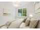 Cozy bedroom with decorative pillows and framed wall art at 1171 Lupo Loop, Chattahoochee Hills, GA 30268