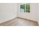 Bedroom featuring wood floors, a large window, and neutral walls at 1171 Lupo Loop, Chattahoochee Hills, GA 30268