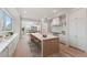 Spacious kitchen features a large island, stainless steel appliances, and white cabinetry at 1171 Lupo Loop, Chattahoochee Hills, GA 30268
