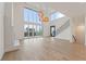 Bright, open living space with soaring ceilings, a fireplace, and expansive glass doors at 1171 Lupo Loop, Chattahoochee Hills, GA 30268