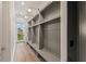 Hallway with custom built-in mudroom lockers offering ample storage at 1171 Lupo Loop, Chattahoochee Hills, GA 30268