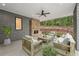 Covered patio includes outdoor seating and stone fireplace at 1171 Lupo Loop, Chattahoochee Hills, GA 30268