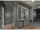 Modern wet bar area complete with a wine fridge, sink, and ample storage space at 1171 Lupo Loop, Chattahoochee Hills, GA 30268