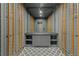 Contemporary wine cellar with metal racking and gray diamond patterned floor at 1171 Lupo Loop, Chattahoochee Hills, GA 30268