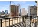 A cityscape view from a balcony featuring modern buildings and ongoing construction at 195 14Th Ne St # 1404, Atlanta, GA 30309