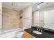 Bathroom featuring a tub, toilet, vanity, and a large mirror at 195 14Th Ne St # 1404, Atlanta, GA 30309