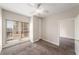 Bedroom featuring a large window with blinds, carpet, and built-in storage at 195 14Th Ne St # 1404, Atlanta, GA 30309
