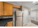 Kitchen featuring a stainless steel fridge and access to nearby doors at 195 14Th Ne St # 1404, Atlanta, GA 30309