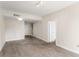 Spacious living room with neutral walls, carpeted floors, and entryways to other parts of the house at 195 14Th Ne St # 1404, Atlanta, GA 30309