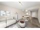 A bright living room featuring carpet, neutral walls, stylish sofa, and a dining table at 195 14Th Ne St # 1404, Atlanta, GA 30309