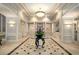 Inviting lobby with a decorative table, marble floors, and elegant lighting at 195 14Th Ne St # 1404, Atlanta, GA 30309