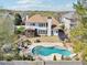 Aerial view showcasing a backyard with a pool, patio, trampoline, screened-in porch, and lush landscaping at 3530 Horizon Ct, Cumming, GA 30041