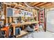 Basement workshop area featuring organized tool storage, workbench, and ample lighting at 3530 Horizon Ct, Cumming, GA 30041