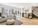 Finished basement with tile flooring, comfortable seating, and natural light, perfect for a cozy living space at 3530 Horizon Ct, Cumming, GA 30041