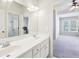 Bathroom features double sinks and vanity with bright natural light shining into the adjacent bedroom at 3530 Horizon Ct, Cumming, GA 30041