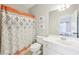 Bright bathroom featuring a shower with patterned curtain, and a modern vanity at 3530 Horizon Ct, Cumming, GA 30041