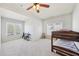Spacious bedroom with large windows, ceiling fan, and a bunk bed for versatile living at 3530 Horizon Ct, Cumming, GA 30041