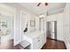 Bonus room features an island, white cabinets, stainless steel appliances, hardwood floors and an adjacent bathroom at 3530 Horizon Ct, Cumming, GA 30041