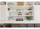 Built in cabinet with wine storage, shelving, and mini fridge at 3530 Horizon Ct, Cumming, GA 30041