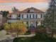 Traditional two-story home with a welcoming front porch, manicured landscaping, and elegant curb appeal at 3530 Horizon Ct, Cumming, GA 30041