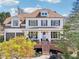 Charming two-story home with a manicured lawn, American flag, and a welcoming front porch at 3530 Horizon Ct, Cumming, GA 30041