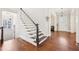 Welcoming foyer featuring gleaming hardwood floors, elegant staircase, and abundant natural light, setting a warm tone at 3530 Horizon Ct, Cumming, GA 30041