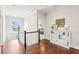 Upstairs hallway with hardwood floors and a view into a bedroom at 3530 Horizon Ct, Cumming, GA 30041