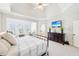 Inviting main bedroom with sitting area, dark wood dresser, and tray ceiling at 3530 Horizon Ct, Cumming, GA 30041