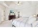 Large main bedroom features tray ceiling, sitting area, neutral colors, and access to the bathroom at 3530 Horizon Ct, Cumming, GA 30041