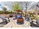 Inviting outdoor patio area with a fire pit, comfortable seating, and a built-in bar for entertaining at 3530 Horizon Ct, Cumming, GA 30041