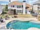 Backyard with a beautiful pool, patio, screened in porch, and plenty of space for entertaining at 3530 Horizon Ct, Cumming, GA 30041