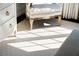 Bright Bedroom: A cozy chair and light filtering through the patterned carpet creates a peaceful atmosphere at 39 Paces West Nw Dr, Atlanta, GA 30327