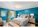 Bright bedroom with turquoise walls, complementary decor, and neutral carpeting at 39 Paces West Nw Dr, Atlanta, GA 30327
