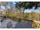Cozy outdoor deck area has patio furniture to enjoy the surrounding landscape and natural beauty at 39 Paces West Nw Dr, Atlanta, GA 30327
