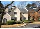 Charming two-story home with meticulously landscaped front yard and neutral color palette at 39 Paces West Nw Dr, Atlanta, GA 30327
