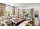 Elegant living room with a decorative rug, neutral-toned furniture, and natural light from expansive windows at 39 Paces West Nw Dr, Atlanta, GA 30327