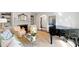 Spacious living room with a fireplace, grand piano, and elegant decor at 39 Paces West Nw Dr, Atlanta, GA 30327