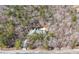 Secluded home nestled among trees, featuring a long driveway and architectural roof at 9246 W Banks Mill Rd, Winston, GA 30187