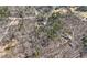 Expansive aerial shot of property with mature trees, offering a private and wooded setting at 9246 W Banks Mill Rd, Winston, GA 30187