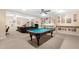 Finished basement with pool table, seating area, and sports memorabilia at 9246 W Banks Mill Rd, Winston, GA 30187