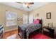 Charming bedroom with hardwood floors and a view from the bright windows at 9246 W Banks Mill Rd, Winston, GA 30187