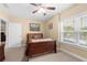 Bedroom featuring neutral paint, large window, and relaxing colors at 9246 W Banks Mill Rd, Winston, GA 30187