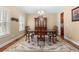 Dining room features an elegant chandelier and beautiful area rug at 9246 W Banks Mill Rd, Winston, GA 30187
