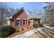 Charming one-story brick home with manicured landscaping and inviting walkway at 9246 W Banks Mill Rd, Winston, GA 30187