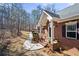 Exterior view of a brick home with a walkway, black shutters, and flower pots at 9246 W Banks Mill Rd, Winston, GA 30187