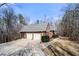 Charming two-car garage with a concrete driveway and well-maintained landscaping at 9246 W Banks Mill Rd, Winston, GA 30187