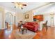 Warm and inviting living room with hardwood floors and open layout to kitchen at 9246 W Banks Mill Rd, Winston, GA 30187