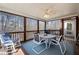 Cozy screened porch with seating, perfect for enjoying outdoor views at 9246 W Banks Mill Rd, Winston, GA 30187