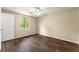 Bedroom with wood flooring, a ceiling fan, and a closet at 7613 Suwannee Ct, Jonesboro, GA 30236